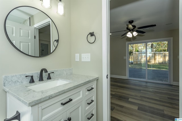 bathroom featuring hardwood / wood-style floors, vanity, and ceiling fan