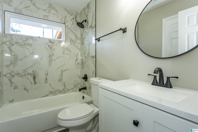 full bathroom featuring toilet, vanity, and tiled shower / bath