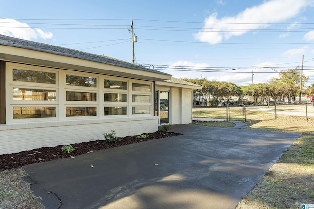 view of side of property with a patio area