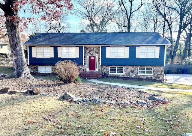 bi-level home with a front yard