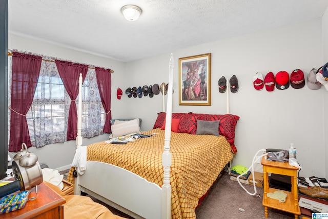 carpeted bedroom with a textured ceiling