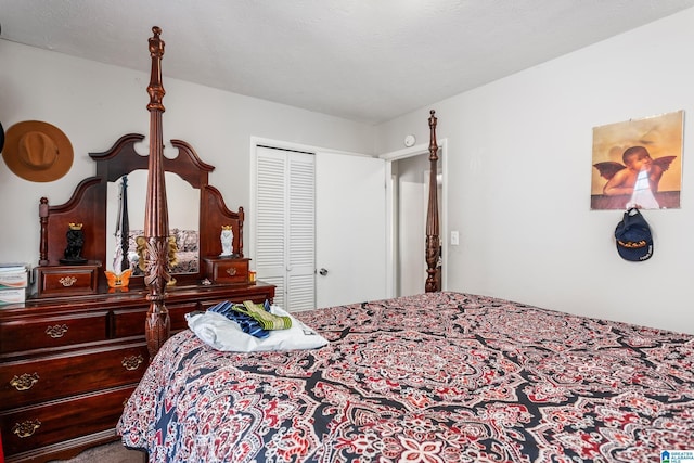 bedroom with a closet and a textured ceiling