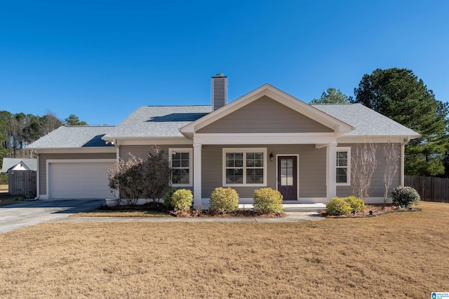 ranch-style home with a porch, a garage, and a front yard