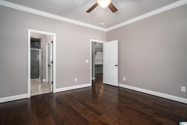 unfurnished bedroom featuring ceiling fan, dark hardwood / wood-style flooring, ornamental molding, and ensuite bathroom