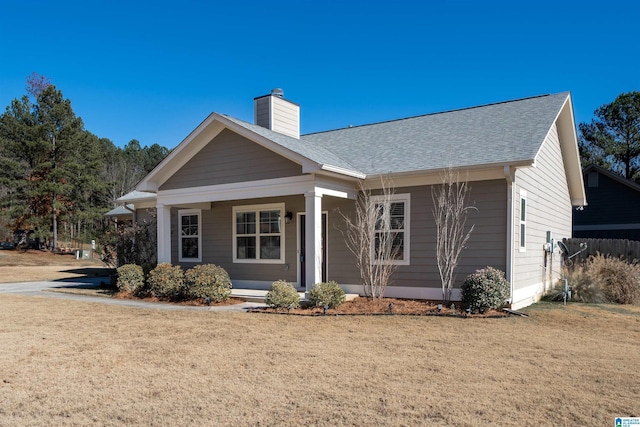 view of front of property with a front lawn and covered porch