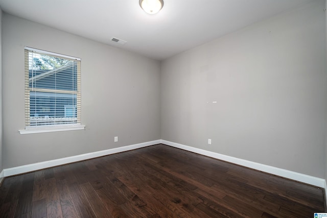 empty room featuring dark hardwood / wood-style floors