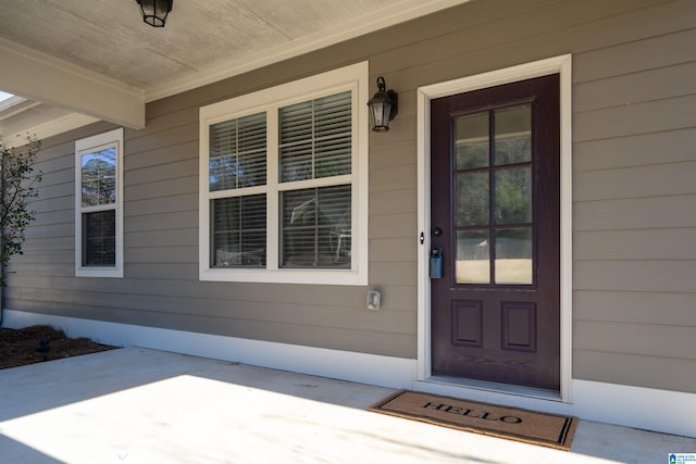 doorway to property featuring covered porch