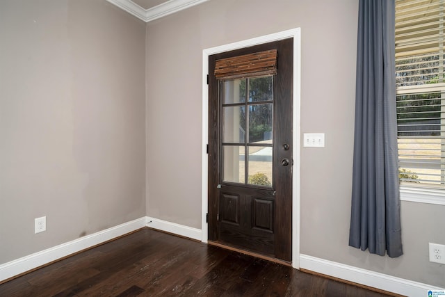 foyer entrance featuring crown molding and dark wood-type flooring