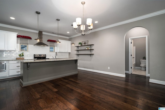 kitchen with a kitchen island with sink, white cabinets, wall chimney range hood, electric stove, and dark hardwood / wood-style flooring