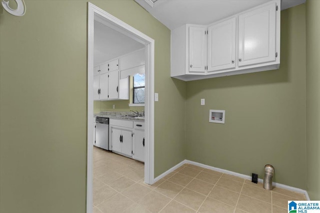 laundry room with cabinets, washer hookup, and sink