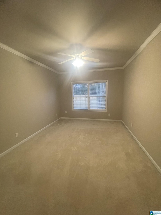 unfurnished room with light carpet, ceiling fan, and crown molding