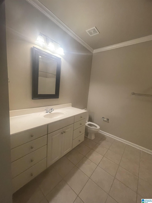 bathroom with tile patterned floors, vanity, toilet, and crown molding