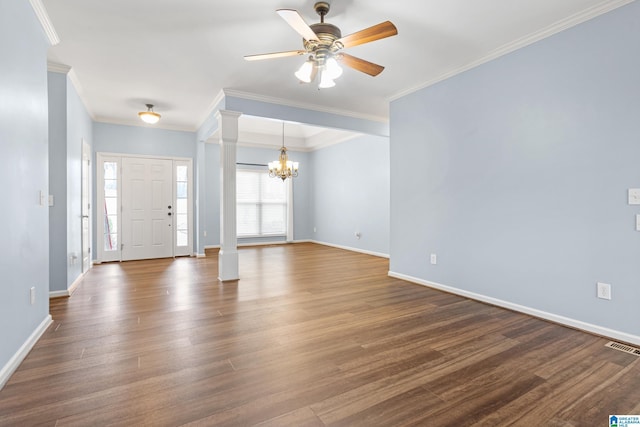 entryway with ceiling fan with notable chandelier, dark wood-type flooring, ornamental molding, and ornate columns