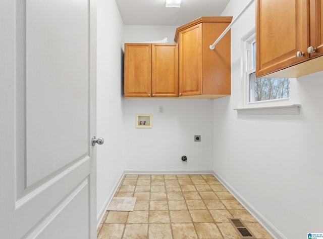 laundry area featuring electric dryer hookup, cabinets, and washer hookup