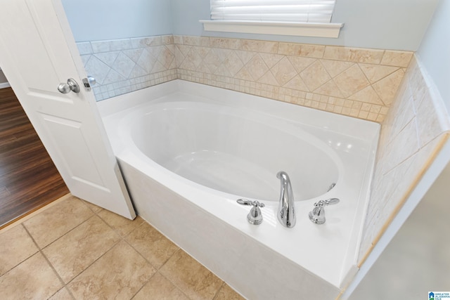 bathroom featuring tile patterned floors and a bathing tub