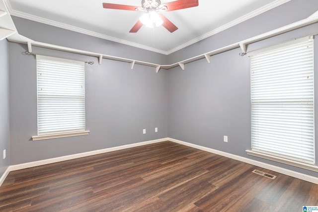 unfurnished room with ceiling fan, dark hardwood / wood-style flooring, and crown molding