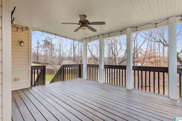 wooden deck featuring ceiling fan