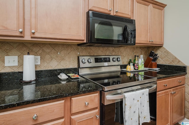 kitchen with tasteful backsplash, dark stone counters, and stainless steel electric range