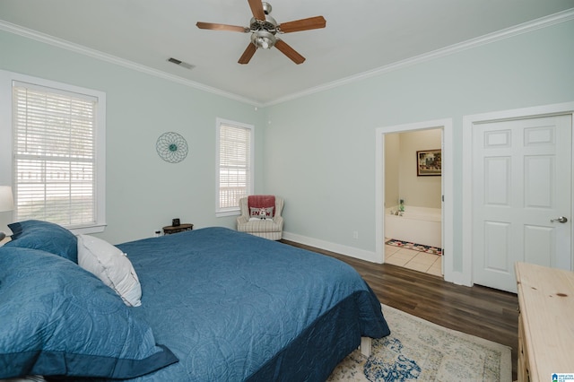 bedroom with ceiling fan, ornamental molding, dark wood-type flooring, and ensuite bath