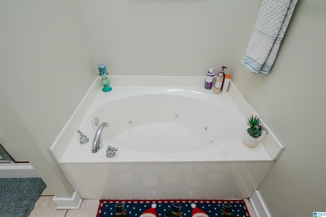 bathroom featuring tile patterned flooring and a tub to relax in