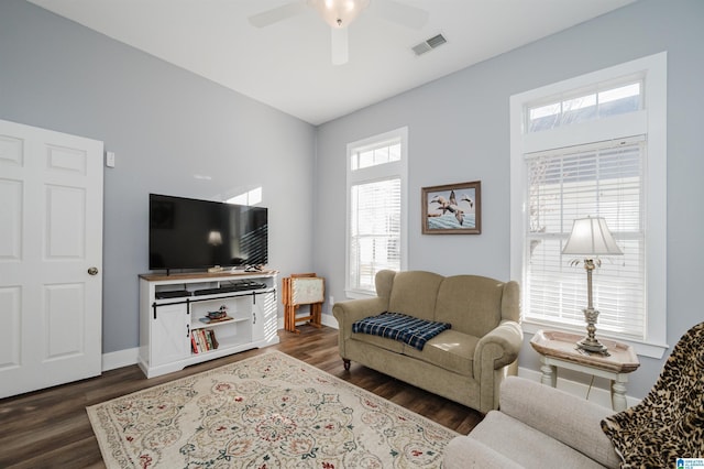 living room with dark hardwood / wood-style floors and ceiling fan