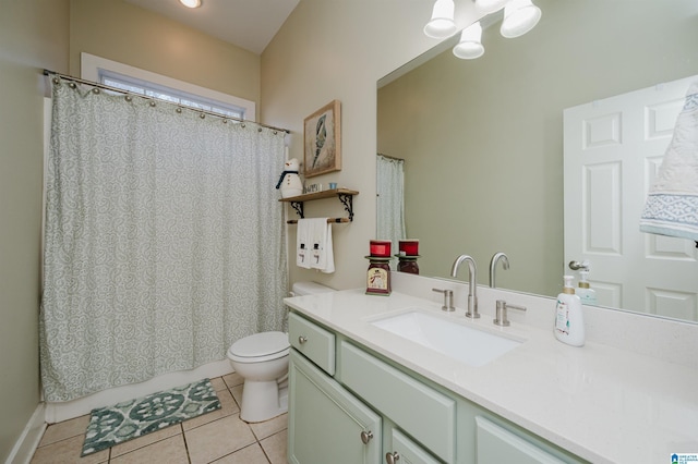 bathroom with tile patterned flooring, vanity, toilet, and a chandelier