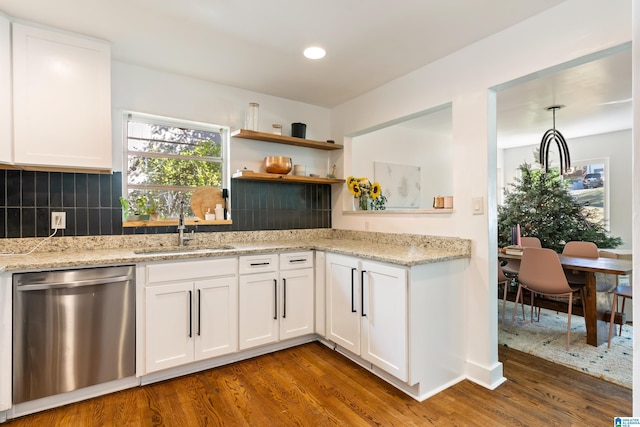 kitchen with white cabinetry, stainless steel dishwasher, dark wood-type flooring, and sink