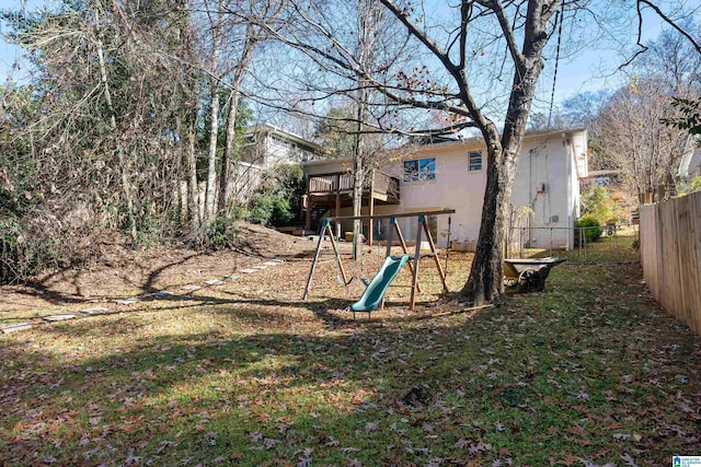 exterior space with a playground and a deck