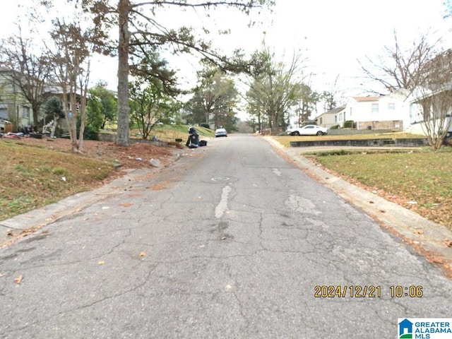 view of street featuring curbs