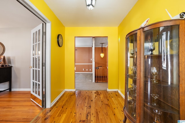 hall with light wood-type flooring