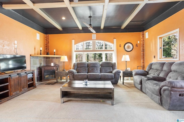 carpeted living room with beam ceiling and ceiling fan