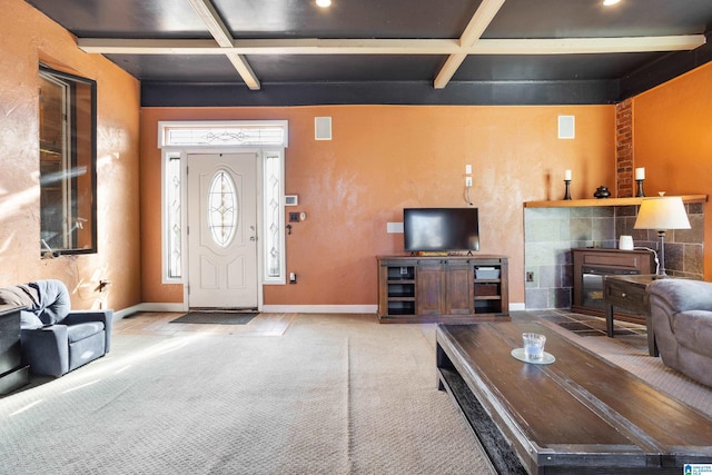 carpeted living room with beam ceiling and coffered ceiling