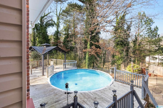 view of swimming pool featuring a wooden deck