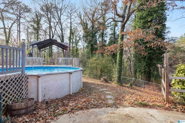 view of swimming pool featuring a deck