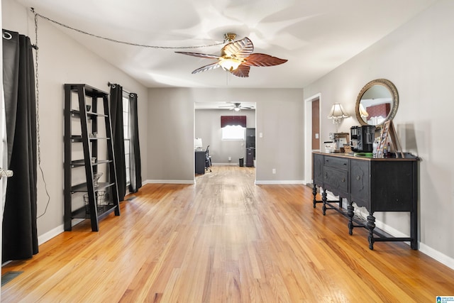 entryway with ceiling fan and light hardwood / wood-style flooring