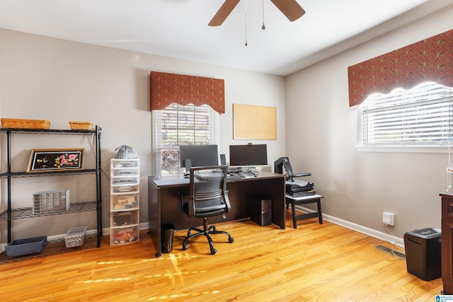 office space with light hardwood / wood-style flooring and ceiling fan