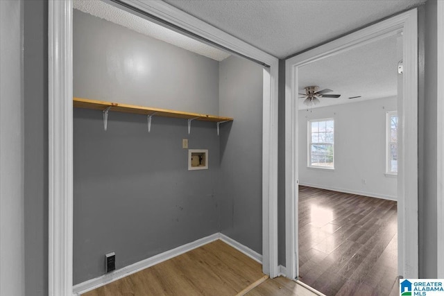 laundry area with hardwood / wood-style floors, ceiling fan, a textured ceiling, and washer hookup