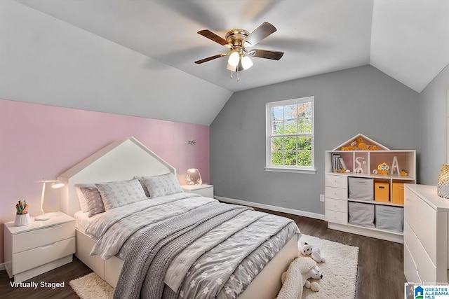 bedroom featuring dark wood finished floors, baseboards, a ceiling fan, and vaulted ceiling