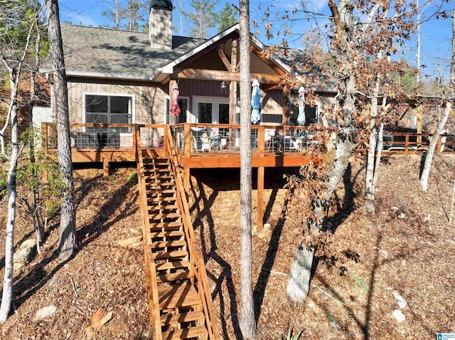 back of house featuring a deck