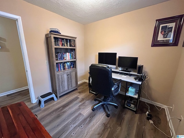 office with a textured ceiling and hardwood / wood-style flooring