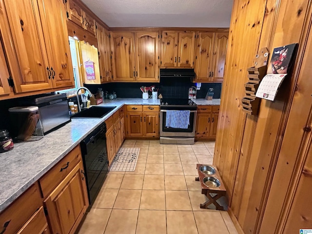 kitchen featuring dishwasher, sink, light tile patterned flooring, backsplash, and stainless steel stove