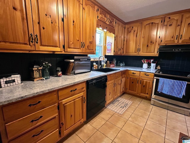 kitchen with a textured ceiling, ventilation hood, sink, black dishwasher, and stainless steel stove