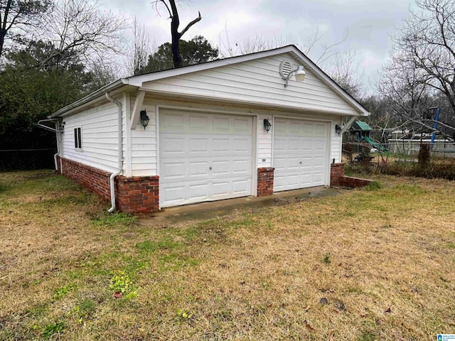 garage featuring a yard