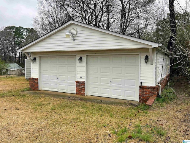 garage with a yard