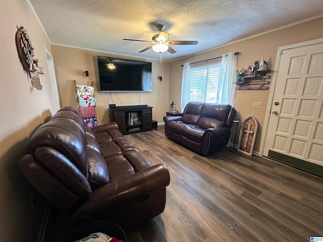 living room with ceiling fan, crown molding, a textured ceiling, and hardwood / wood-style flooring