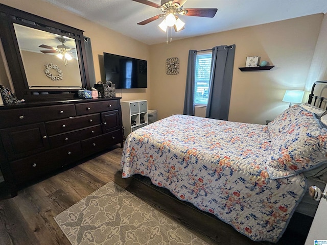 bedroom featuring ceiling fan and hardwood / wood-style flooring