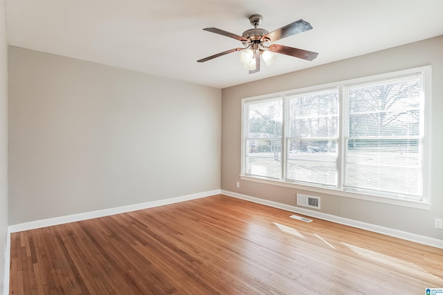 unfurnished room featuring ceiling fan and light wood-type flooring