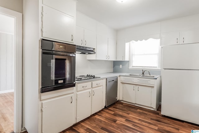 kitchen featuring sink, stainless steel dishwasher, white refrigerator, oven, and white cabinets