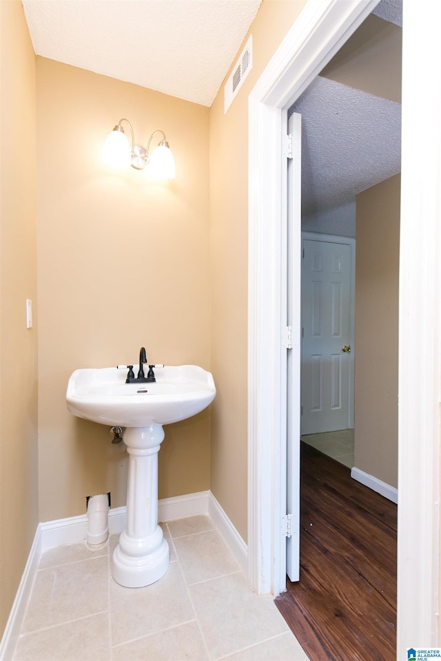 bathroom with tile patterned floors