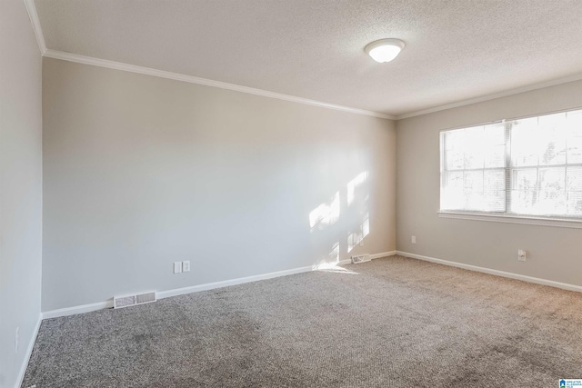 unfurnished room with a textured ceiling, carpet floors, and crown molding